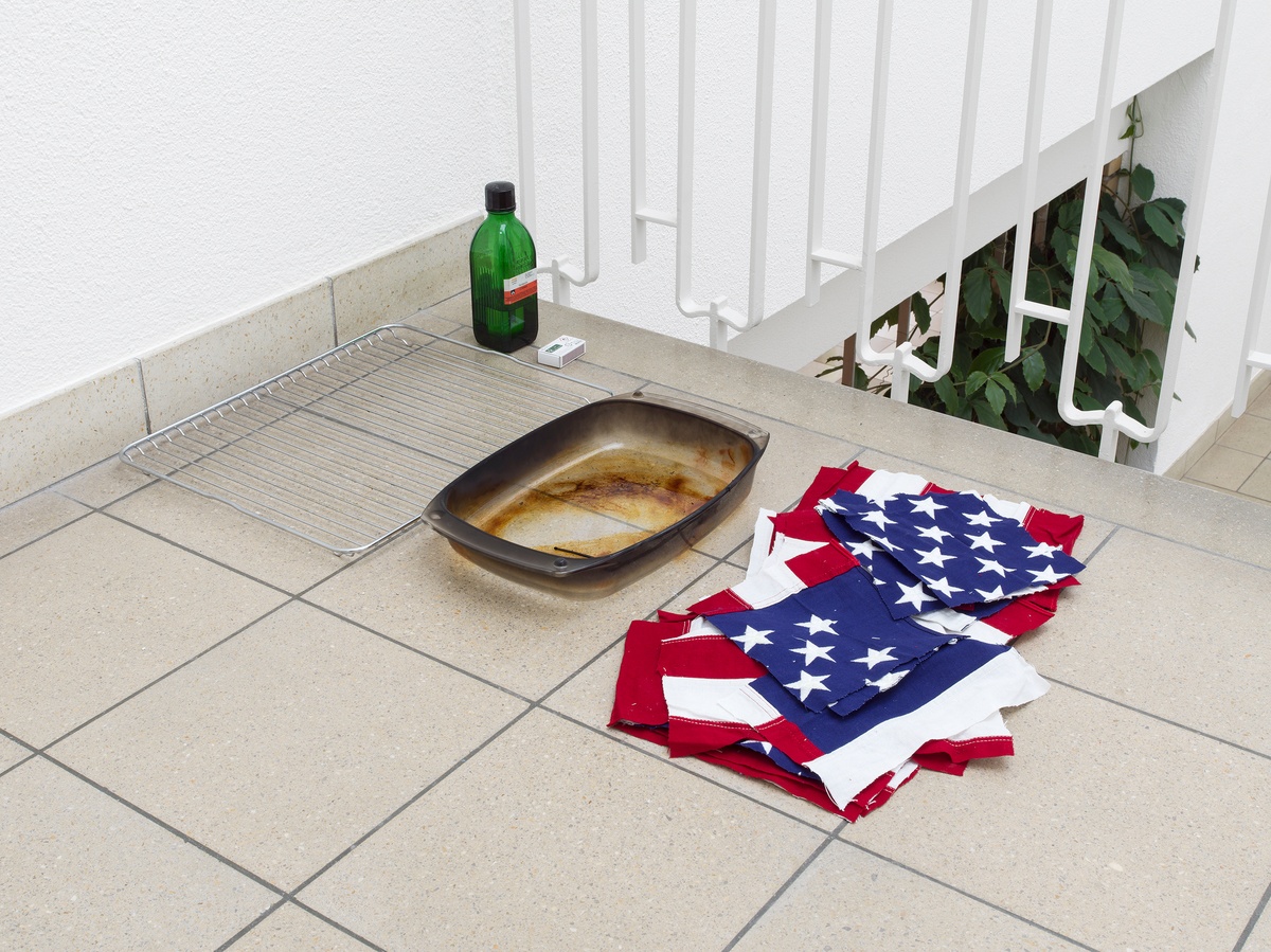 Puppies Puppies (Jade Guanaro Kuriki-Olivo)Flag Burning Kit (collaboration with Ren Light Pan), 2019, Glass cooking tray, grill, cotton fabric, rubbing alcohol, lighter or matches